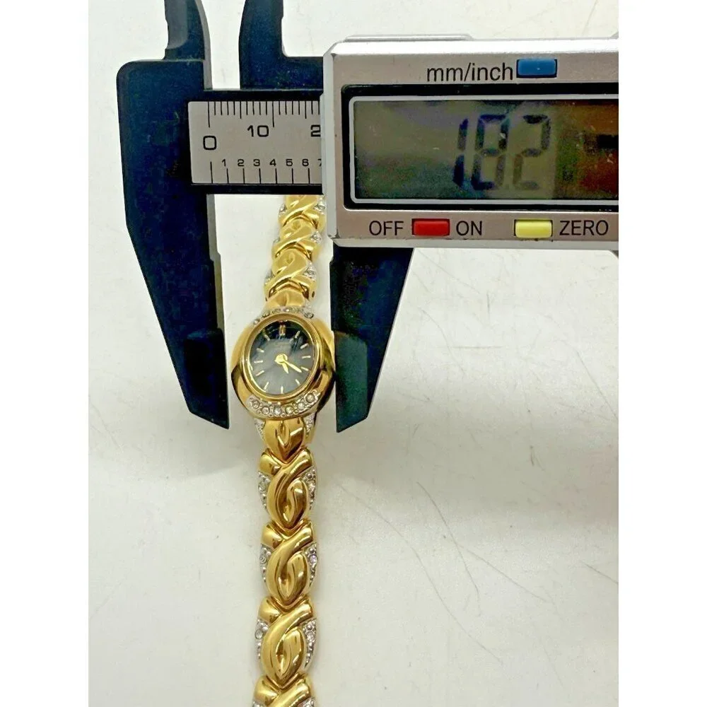 Vtg Caravelle by Bulova Quartz Womens Oval Watch Two Tone Black Face Rhinestones